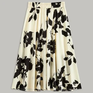 Jupe mi-longue amincissante taille haute imprimée